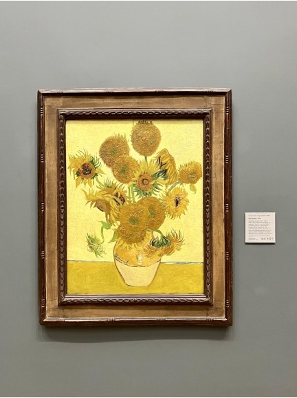 Van Gogh's "Sunflowers" hangs on the wall in the National Gallery.
