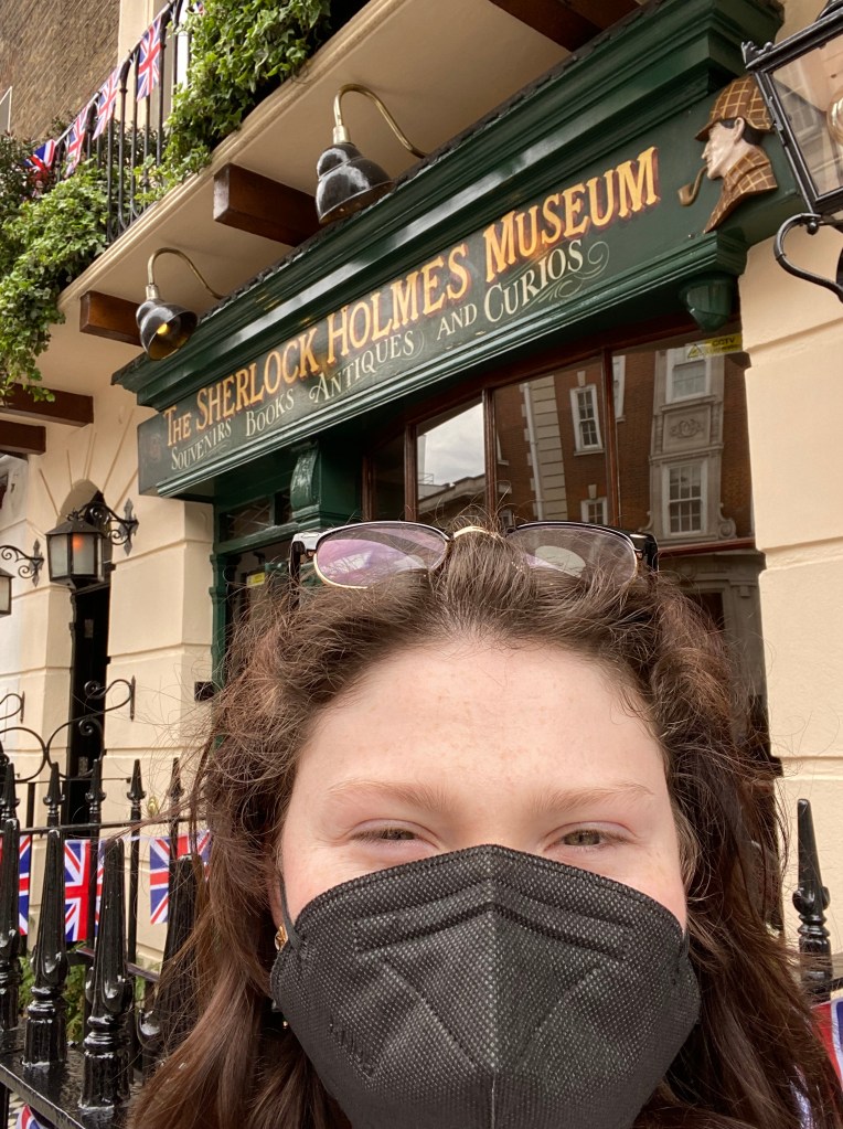 Student taking a selfie in front of The Sherlock Holmes Museum in England.